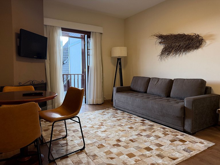 Flat com varanda e conforto nas montanhas