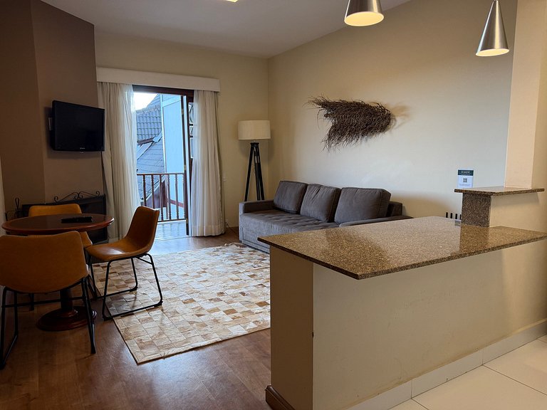 Flat com varanda e conforto nas montanhas