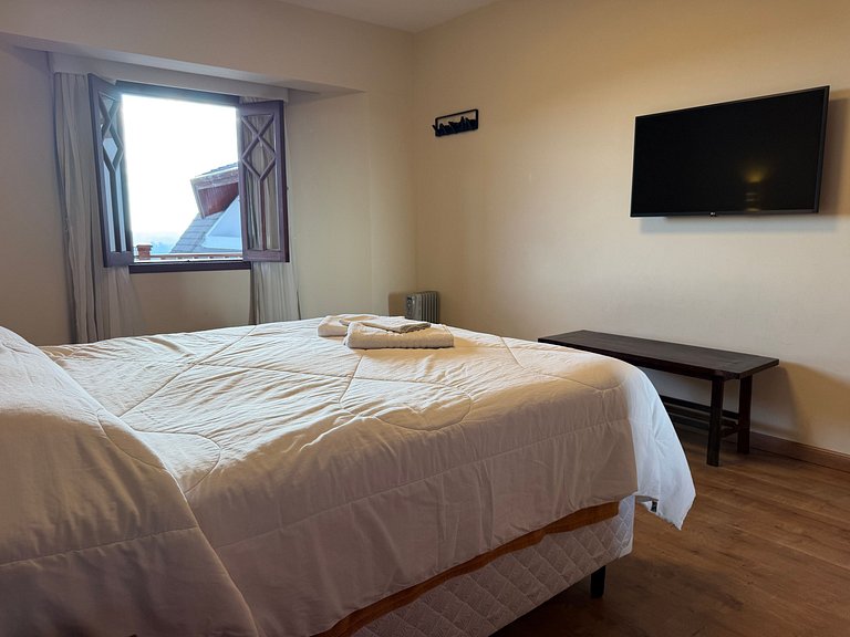 Flat com varanda e conforto nas montanhas